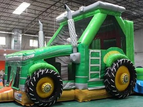 Giant Green Tractor Bounce House.