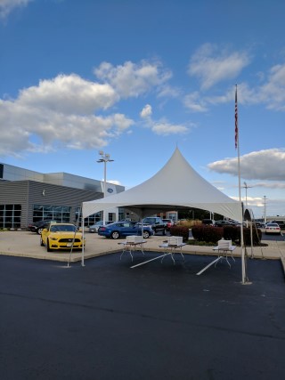 Corporate Event - 20' x 20' Frame Tent, White Padded Chairs, Rectangular Tables. Parking Lot Sale. Free Span, Tension Frame, California Style.